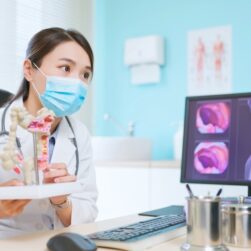 Asian,Female,Doctor,Wearing,Face,Mask,Is,Showing,A,Model
